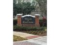 Villas at East Park community sign surrounded by mature landscaping and greenery at 10852 Spider Lily Dr # S, Orlando, FL 32832