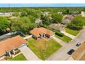 An aerial view shows the property's location within a lush, green, and well-established neighborhood at 1330 Broken Pine Rd, Deltona, FL 32725