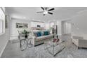 Spacious living room featuring modern decor, stylish furniture, and an open-concept design with great natural light at 17309 Cagan Crossing Blvd, Clermont, FL 34714