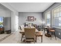 Formal dining room with large wooden table and seating, accented by stylish decor at 199 Boysenberry Ln, Daytona Beach, FL 32124