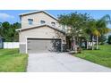 Charming home featuring well-manicured landscaping and an attached two-car garage at 199 Boysenberry Ln, Daytona Beach, FL 32124