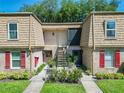 A charming two-story townhouse featuring well-maintained landscaping and a welcoming entrance at 200 Saint Andrews Blvd # 1004, Winter Park, FL 32792