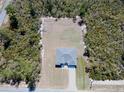 Aerial view of a house on a large lot surrounded by trees at 2232 Sw 178Th Lane Rd, Ocala, FL 34473