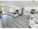 Open-concept living space with modern kitchen, dining area, and comfortable seating at 2232 Sw 178Th Lane Rd, Ocala, FL 34473