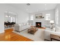 Bright living room with fireplace, built-in shelves, and hardwood floors at 525 Sheridan Blvd, Orlando, FL 32804