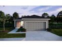 Charming single-story home with a two-car garage, manicured lawn, and inviting curb appeal at 5535 Maddie Dr, Haines City, FL 33844