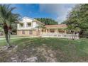 Inviting home exterior boasting a well-kept lawn, charming white picket fence, and fresh landscaping at 1204 Swan St, Winter Springs, FL 32708