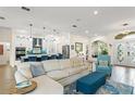 Inviting living room with a cozy seating arrangement, stylish decor, and seamless transition to the kitchen at 6410 Bendelow Dr, Lakeland, FL 33810