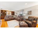Comfortable living room with built-in shelves, large sectional couch, and natural light at 2906 E Grant Ave, Orlando, FL 32806