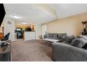 A comfortable living room next to a lovely kitchen at 325 Lakepointe Dr # 303, Altamonte Springs, FL 32701