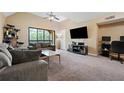 Spacious living room features a ceiling fan and large window allowing natural light at 325 Lakepointe Dr # 303, Altamonte Springs, FL 32701