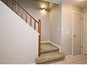 Carpeted staircase with wooden railing and white trim, providing a transition to the upper level at 615 Clemson Dr, Altamonte Springs, FL 32714