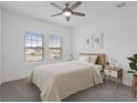 Bright main bedroom with neutral colors, ceiling fan and ample natural light at 1030 Alabaster Way, Deltona, FL 32725