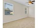 Bright and spacious bedroom with neutral walls and carpet, illuminated by two large windows at 1162 Lebanon Ct, Sanford, FL 32771