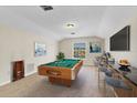 Recreation room with pool table, bar, and TV, perfect for entertaining and relaxing at 1162 Lebanon Ct, Sanford, FL 32771