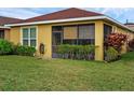 Back exterior of home featuring a screened in porch at 1390 Harbor Ridge Dr, Kissimmee, FL 34759