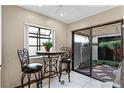 Cozy breakfast nook featuring a small table and chairs, with a view of the outdoor patio at 1010 W Pebble Beach Cir, Winter Springs, FL 32708