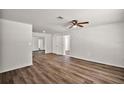 Spacious living room with new floors, modern ceiling fan, and neutral paint at 33830 S Haines Creek Rd, Leesburg, FL 34788