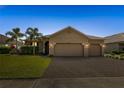 Beautiful single-story home with a spacious brick driveway and well-manicured front yard at 3936 Parkhouse Dr, Orlando, FL 32824