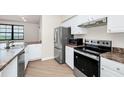Modern kitchen boasts stainless steel appliances, sleek countertops, and ample cabinet space at 911 N Orange Ave # 541, Orlando, FL 32801