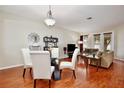 Inviting living room featuring a glass table with chairs and comfortable couches, great for relaxing at 14717 Royal Poinciana Dr, Orlando, FL 32828