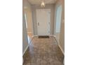Welcoming entryway featuring neutral walls, tile flooring and a stylish front door mat at 217 Longleaf Ct, Orlando, FL 32835