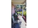 Cozy front porch with comfortable seating and tranquil garden view at 1066 Geneva Dr, Oviedo, FL 32765