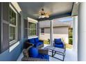 Inviting front porch with comfortable seating, perfect for relaxing and enjoying the outdoors at 13034 Royal Fern Dr, Orlando, FL 32828