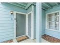 Close-up of the entryway with two doors with electronic lock and door mat at 2047 Royal Bay Blvd # 21, Kissimmee, FL 34746