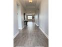 Inviting entryway showcasing neutral walls, stylish flooring, and a glimpse into the living area of this well-maintained home at 2445 Verde View Dr, Apopka, FL 32703