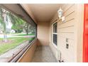 Cozy screened-in porch with neutral tones, offering a relaxing outdoor space at 2621 Ardon Ave, Orlando, FL 32833