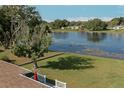 Aerial view of the home showing the roof and expansive water views behind the property at 3 Poinsettia Dr, Debary, FL 32713