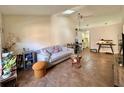 Open-concept living room with tiled floors and ample space for entertaining guests at 318 Douglas Way # 87, Winter Garden, FL 34787