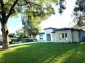 Stunning curb appeal with lush lawn and modern architectural details at 3764 Rachel St, Apopka, FL 32703