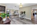 Open-concept living room featuring a workstation and a view of the comfortable sitting area, creating a versatile space at 381 Red Mulberry Ct, Longwood, FL 32779