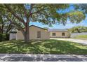 The home shows a well-manicured lawn and a privacy fence at 725 Laurel Way, Casselberry, FL 32707
