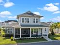 Charming two-story home with a screened-in porch, landscaped yard, and inviting curb appeal at 921 Bradenville Ln, Winter Garden, FL 34787