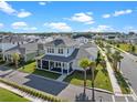 Charming two-story home with a screened-in porch and well-maintained landscaping in a desirable neighborhood at 921 Bradenville Ln, Winter Garden, FL 34787
