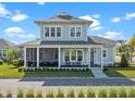 Charming two-story home with a screened-in porch, landscaped yard, and inviting curb appeal at 921 Bradenville Ln, Winter Garden, FL 34787