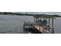 Boat dock with boat lift on the lake at 277 South St, Fern Park, FL 32730