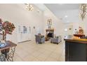 Open floor plan living room with abundant natural light, a fireplace, and stylish decor at 5208 Oakdale Rd, Haines City, FL 33844