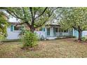 Charming single-story home with a well-maintained front yard and mature trees at 1825 Baldwin Dr, Orlando, FL 32806