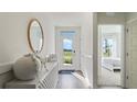 Bright entryway featuring stylish decor and a view of the exterior through a glass door at 1078 Clay Blvd, Tavares, FL 32778