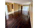 Inviting room with hardwood floors, white trim, and natural light at 12101 Kendra Ct, Orlando, FL 32824