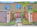 Inviting front entrance with a red door, well-maintained landscaping and clear unit numbers at 200 Saint Andrews Blvd # 1603, Winter Park, FL 32792