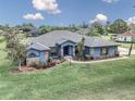 Lovely single-story home with lush lawn, mature landscaping, and a long driveway at 4037 Se 40Th St, Ocala, FL 34480