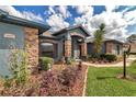 Inviting front entrance with beautiful stone and blue painted exterior at 4037 Se 40Th St, Ocala, FL 34480