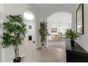 Welcoming hallway with tile flooring leading to the dining area at 4102 Breakview Dr # 30603, Orlando, FL 32819