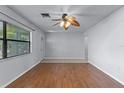 Bright living room with hardwood floors, neutral walls and modern ceiling fan at 622 Mount Homer Rd # 622, Eustis, FL 32726