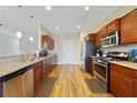 Well-equipped kitchen with stainless steel appliances, granite counters, and ample cabinet space at 741 Mystic Oaks Ln, Deland, FL 32724